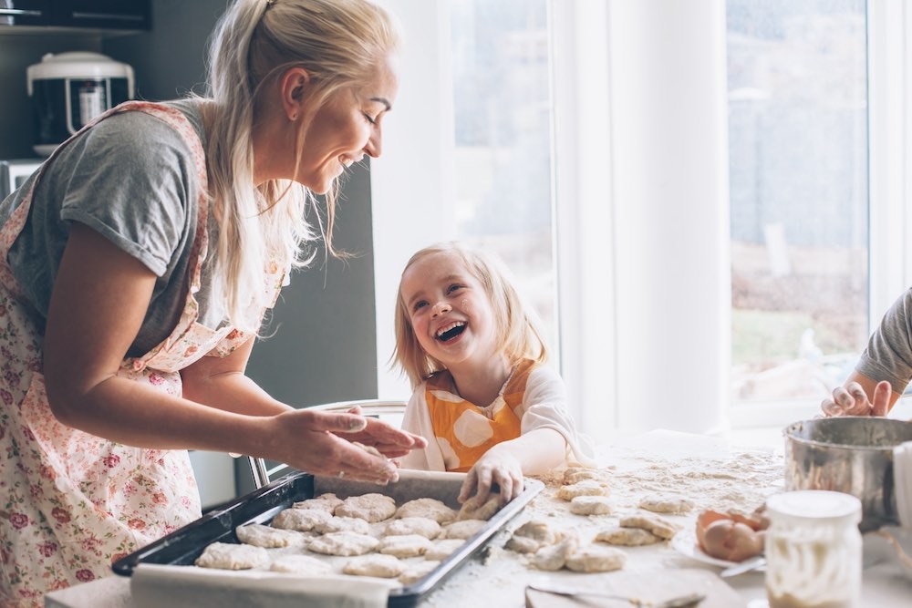 mom and daughter baking in the kitchen